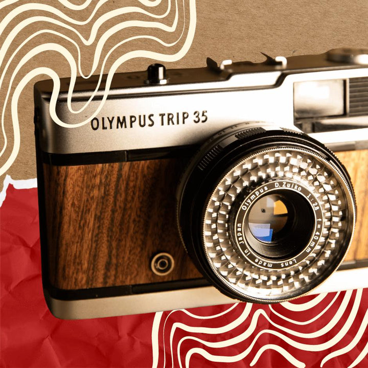 Olympus Trip 35mm film camera with illustration