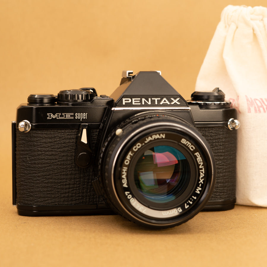 Black Pentax ME Super with 50mm f/2 Lens and Roll of Film