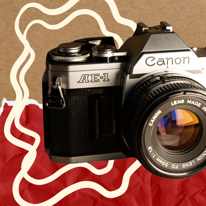 35mm SLR film cameras - the Canon AE-1 on brown paper background - eco-friendly 35mm film camera shop