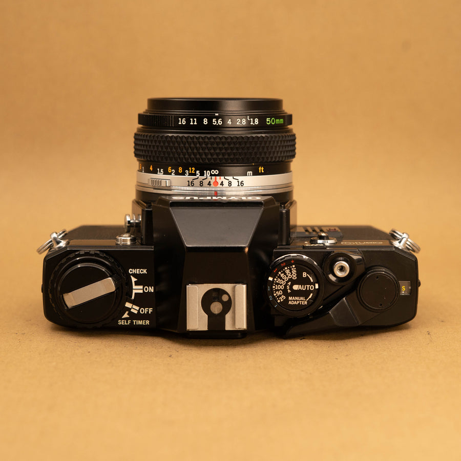 Black Olympus OM10 with 50mm f/1.8 Lens
