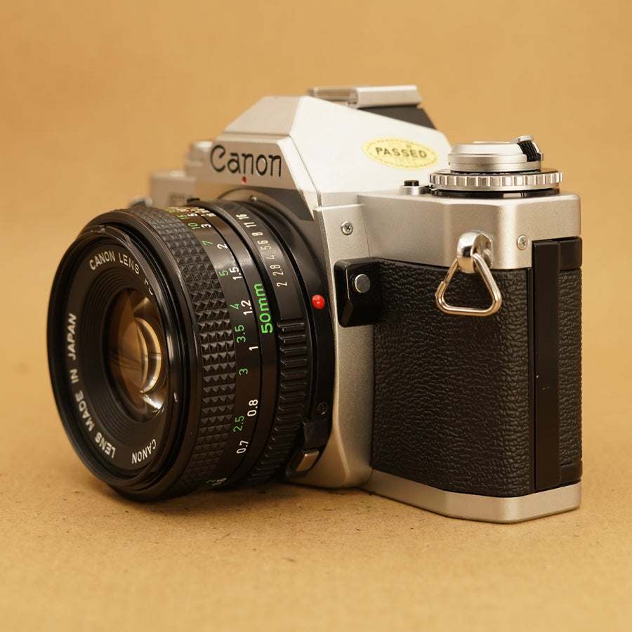 Canon AV-1 Avec Objectif FD 50mm F/1.8 S.C. - Argentique 35mm - Japon - Occasion Révisée