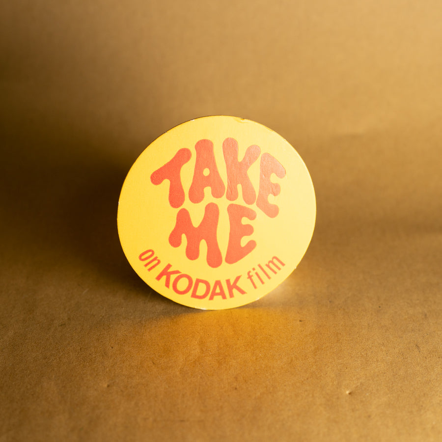 Vintage Kodak "Take Me on Kodak Film" Badge