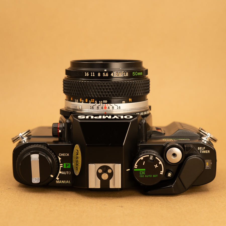 Olympus OM40 Program in Black with 50mm f/1.8 Lens – Cameras By