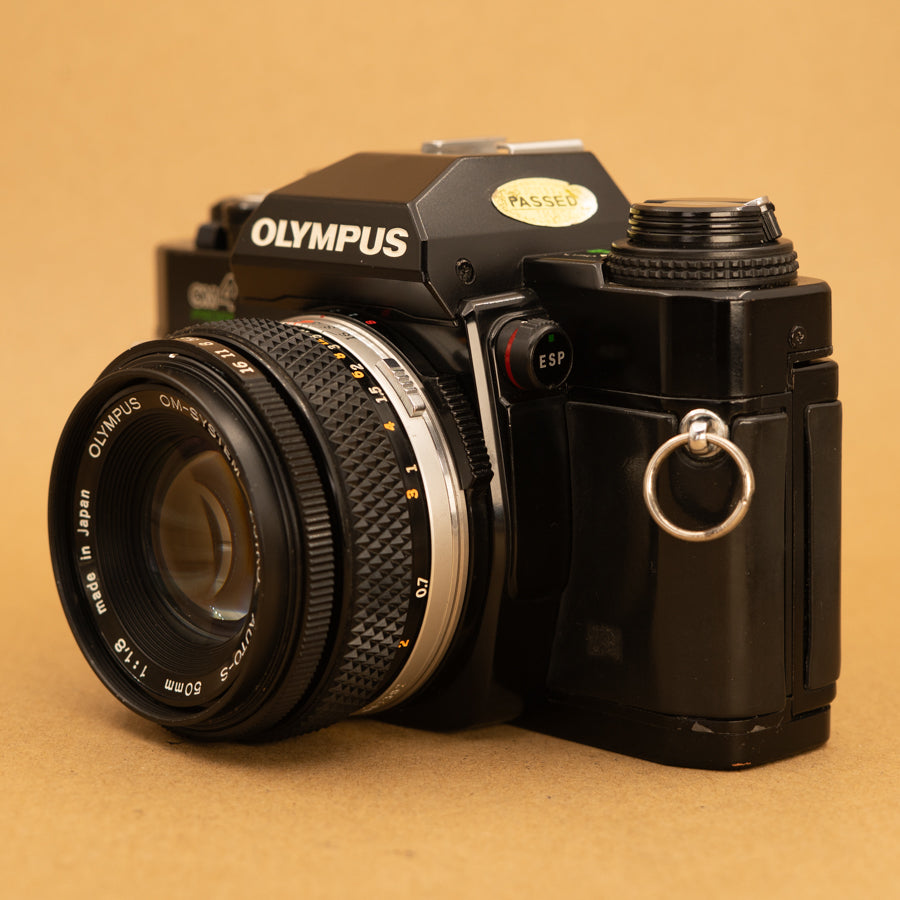 Olympus OM40 Program in Black with 50mm f/1.8 Lens – Cameras By
