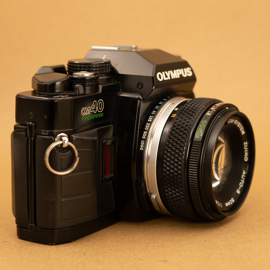 Olympus OM40 Program in Black with 50mm f/1.8 Lens – Cameras By