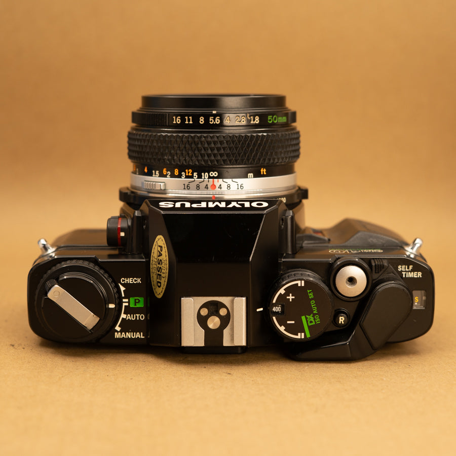 Olympus OM40 Program in Black with 50mm f/1.8 Lens – Cameras By