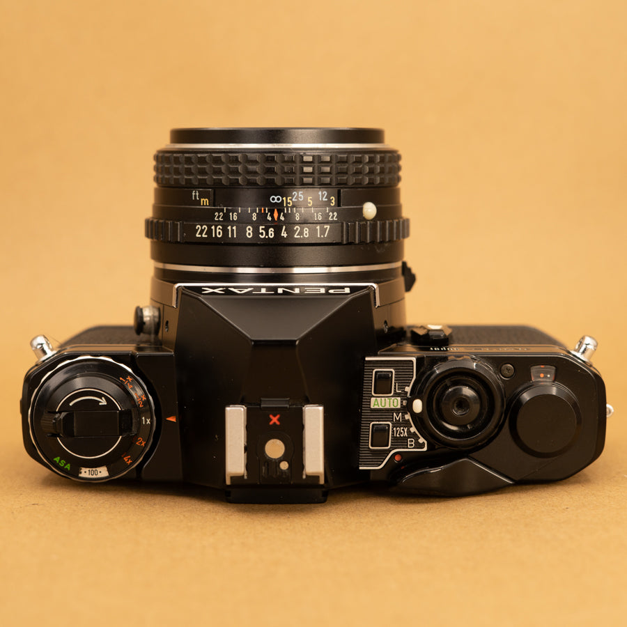 Black Pentax ME Super with 50mm f/2 Lens and Roll of Film