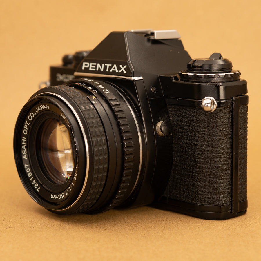 Black Pentax ME Super with 50mm f/2 Lens and Roll of Film