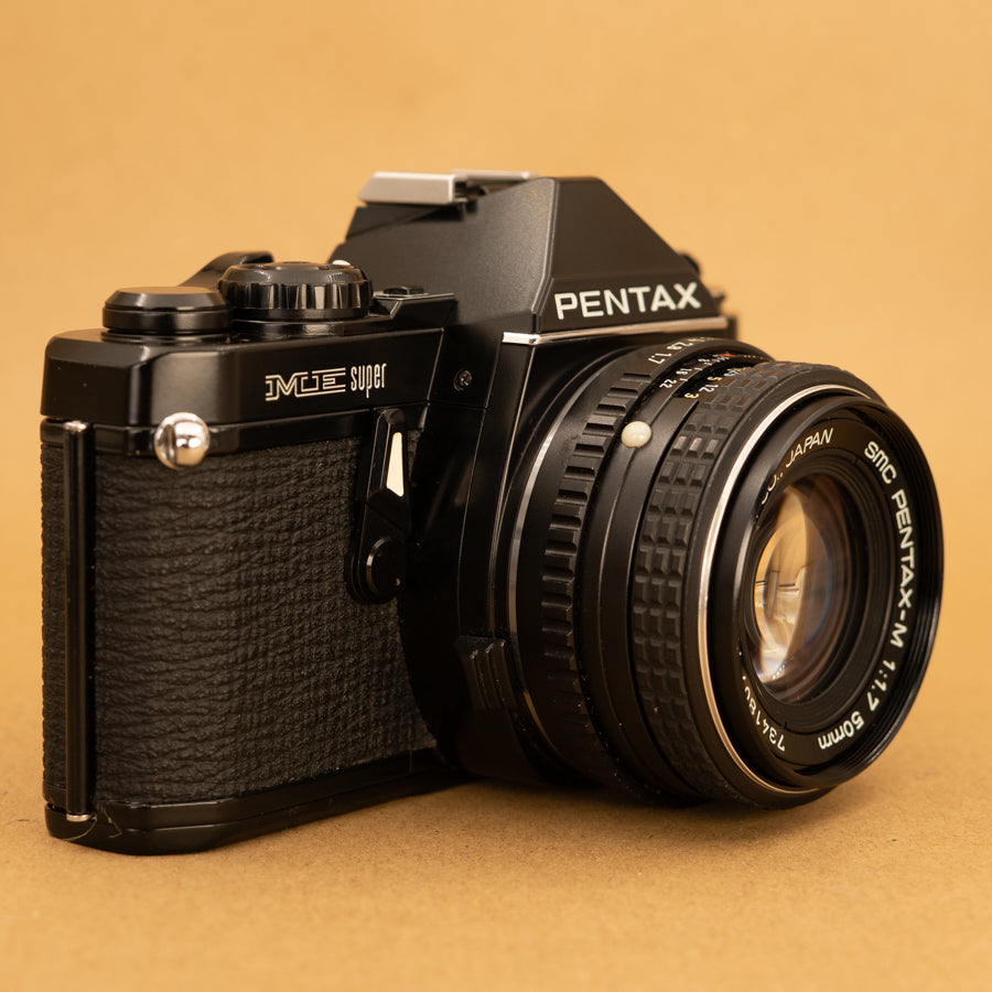 Black Pentax ME Super with 50mm f/2 Lens and Roll of Film