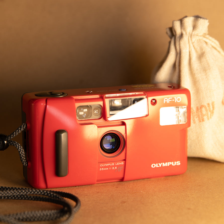 Olympus AF-10 35mm point and shoot film camera for 35mm film photography for beginners and sharp images in limited edition red